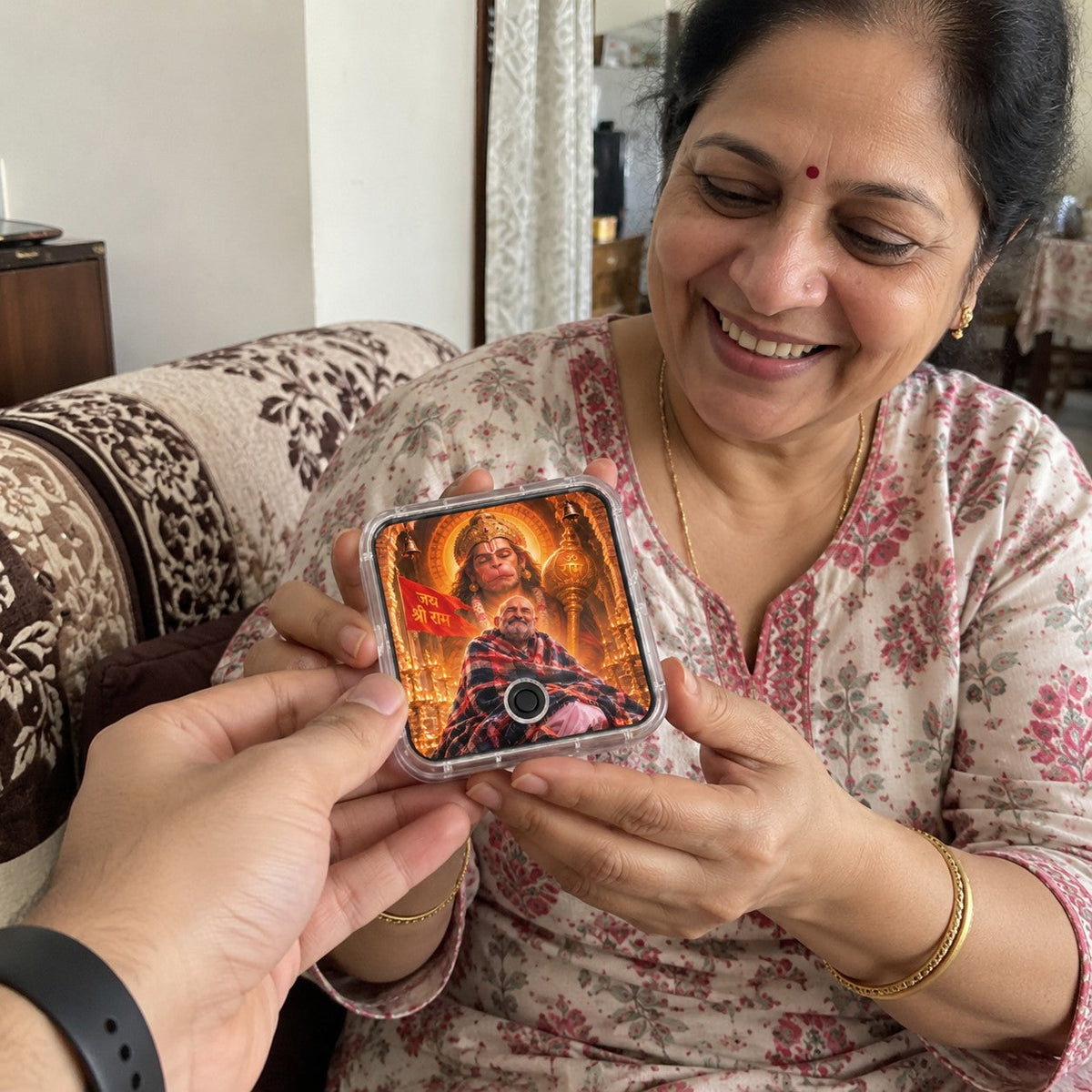 Son gifting Hanuman Chalisa Musical Magnet to mother